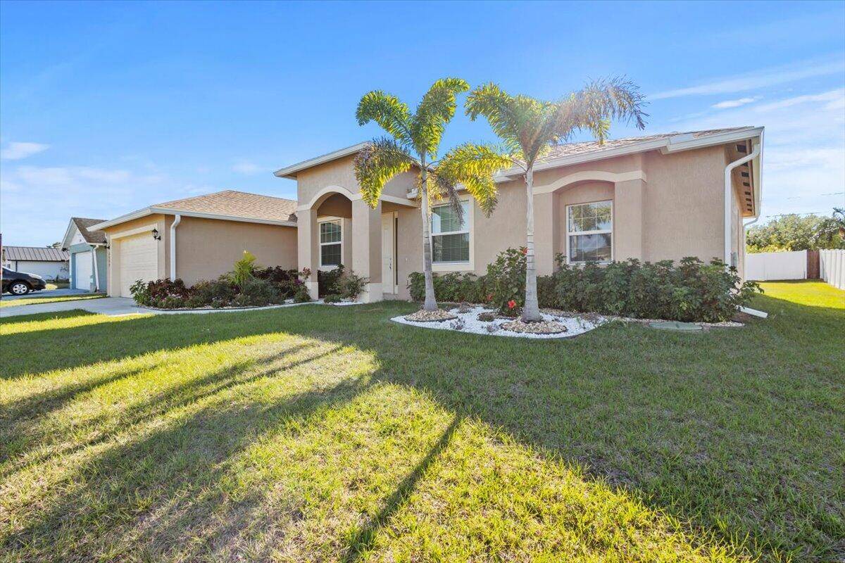 Grand features set this home apart 2023 roof, full IMPACT windows and doors, and a fully fenced backyard !