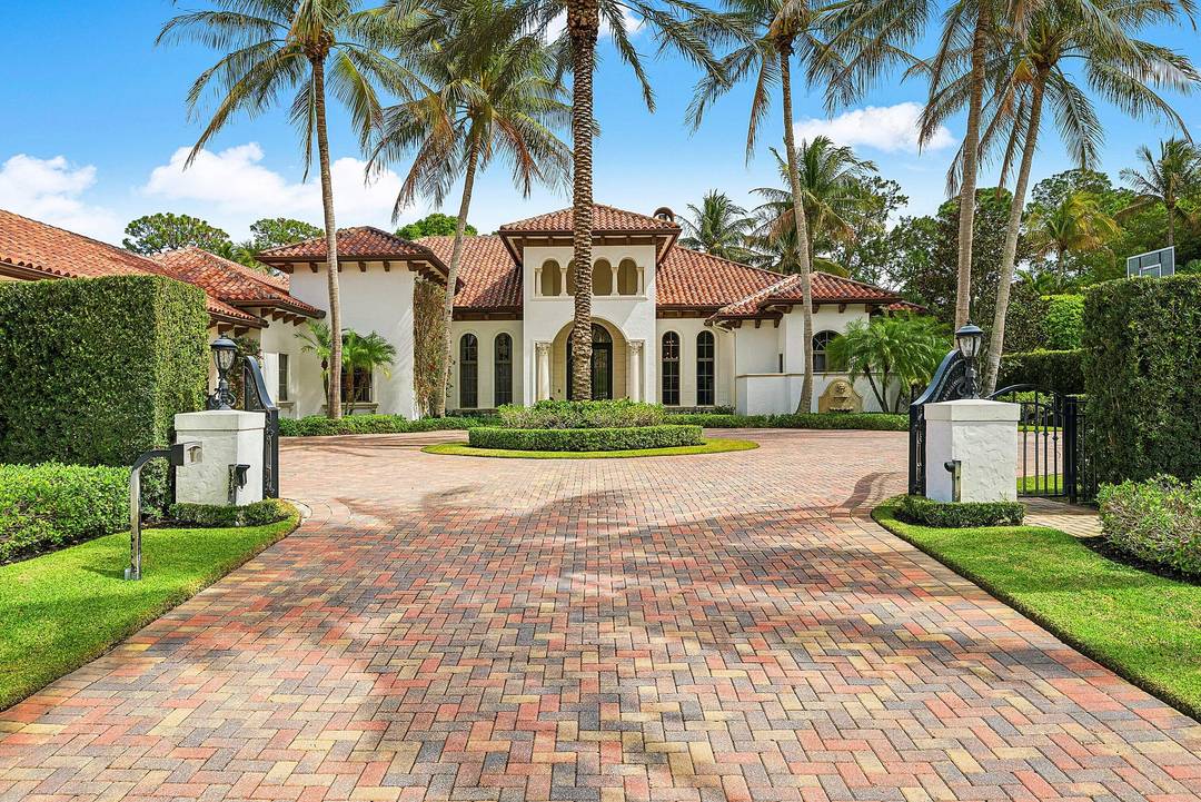Located within the privately gated Flagler Estates, a rare opportunity to own a magnificent custom residence in prestigious Breakers West, built in 2007.