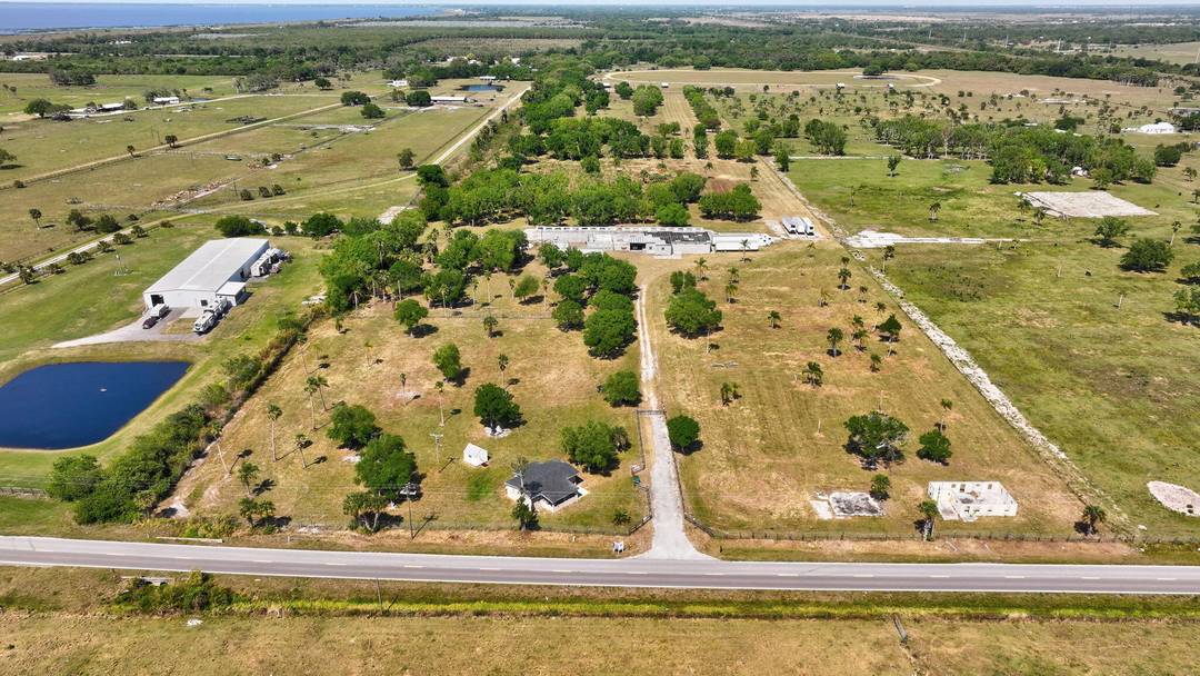 Amazing Opportunity Wide Open Space on 55 Acres, Home Features 2 Bedroom 1 Bath with Tile Flooring, Kitchen with Lots of Cabinets, Impact Windows, Water Filtration System, Spacious Covered Porch, ...
