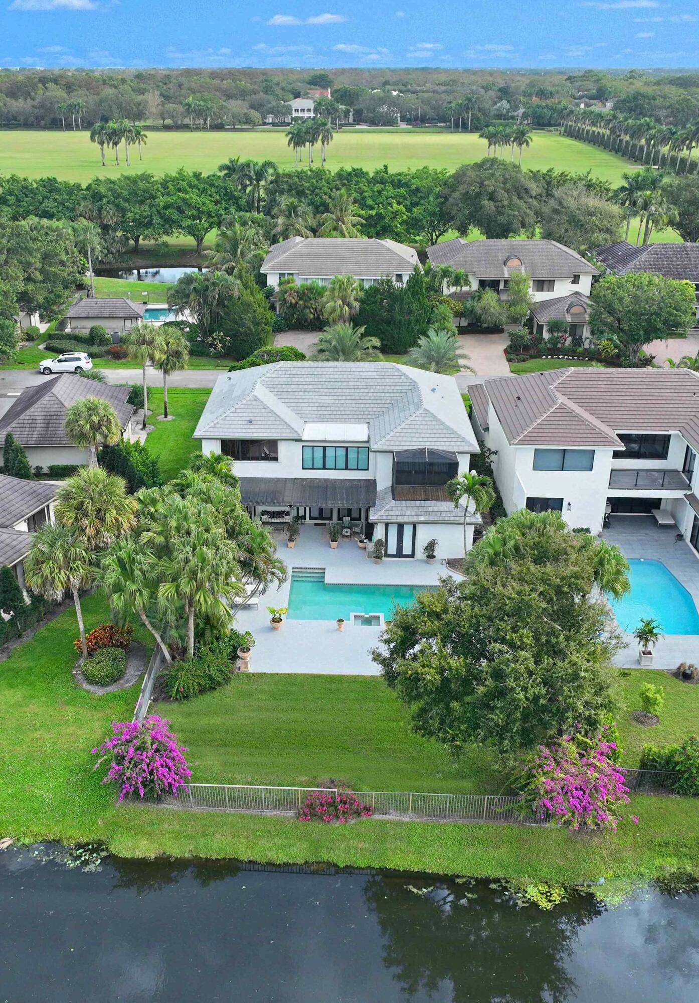 Nestled on one of the polo club's most picturesque streets, this spacious 4 bedroom plus an office, 5 bathroom home offers the ultimate equestrian lifestyle.