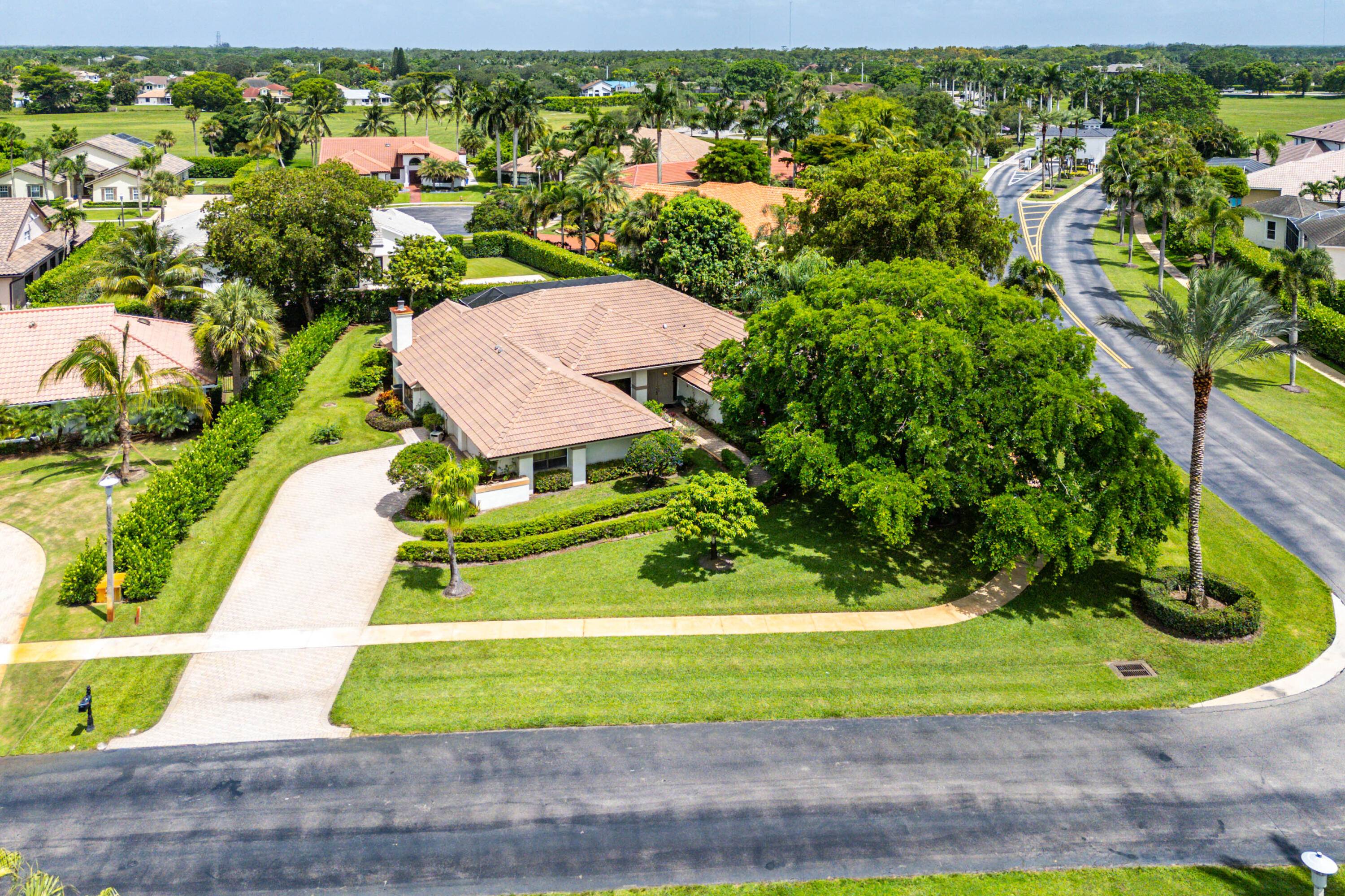 Beautiful Pool Home on Expansive Corner LotThis beautifully maintained pool home sits on a generous corner lot in a quiet, gated community, offering privacy, space, and exceptional features throughout.