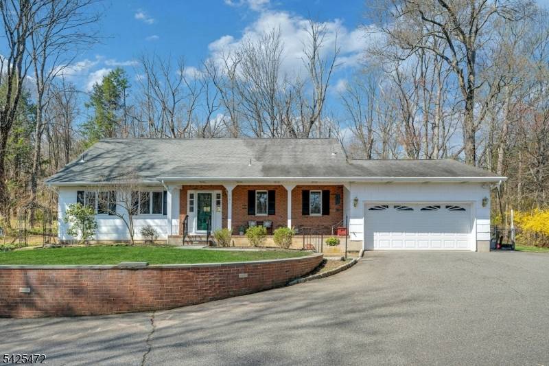 Overlooking the scenic Rockaway River and majestic falls, this charming 3 bedroom, 2.