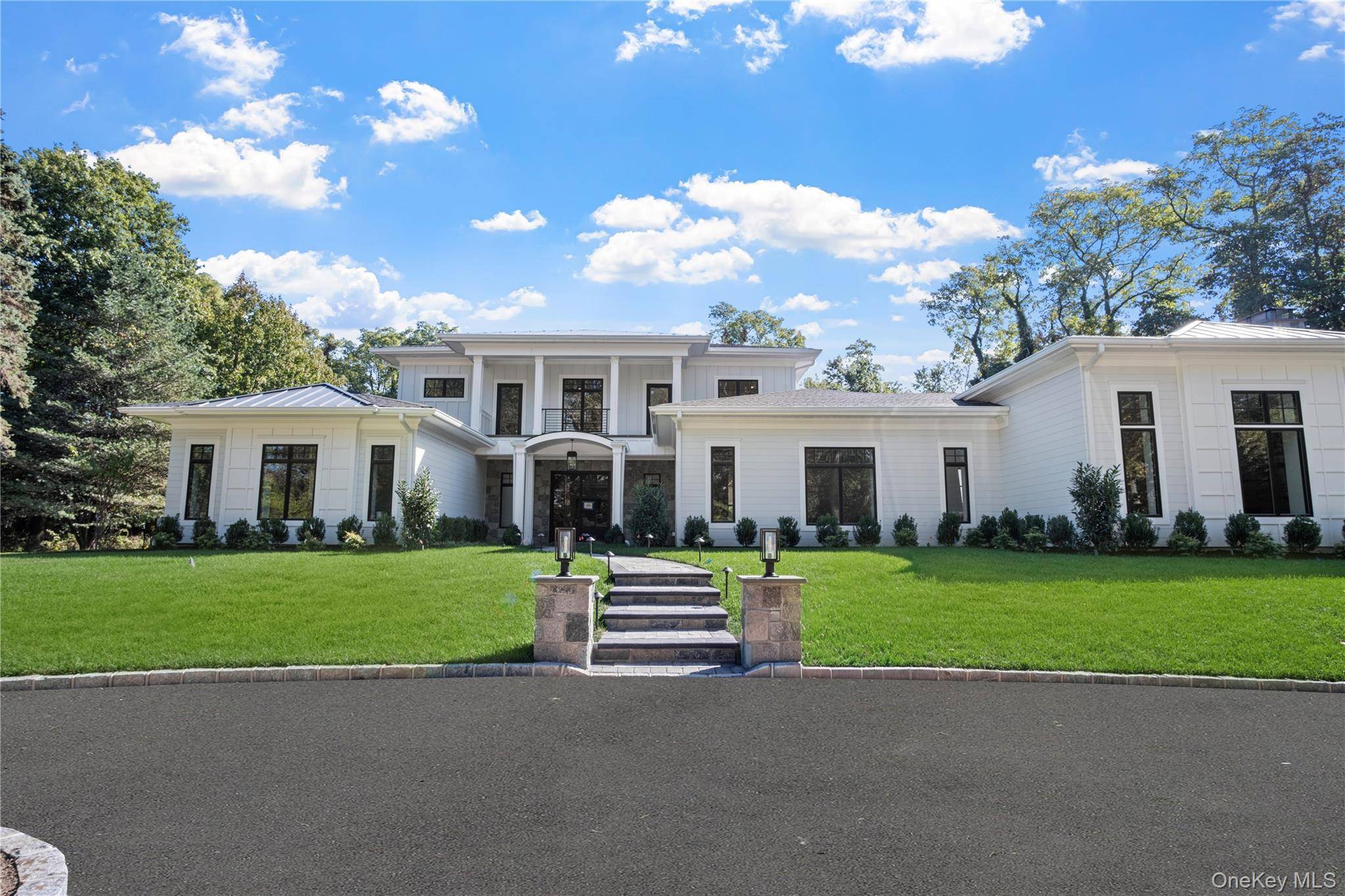 Introducing an extraordinary newly constructed estate encompassing 8, 500 square feet of refined living space, gracefully situated on two serene acres in the heart of Nissequogue.