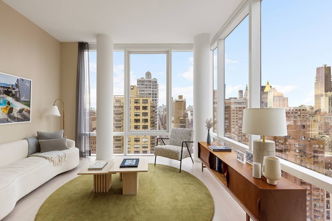 An Expansive Corner 2 Bedroom Home Office with Iconic Skyline Views !