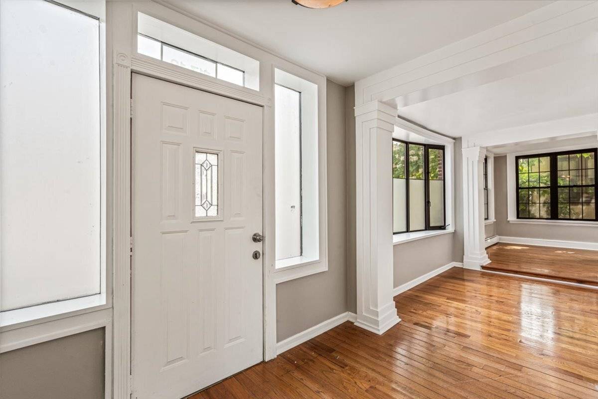 Fully renovated Tudor style detached home in Forest Hills Gardens with 5 bedrooms, 3 full bathrooms, an oversized yard, and parking garage.