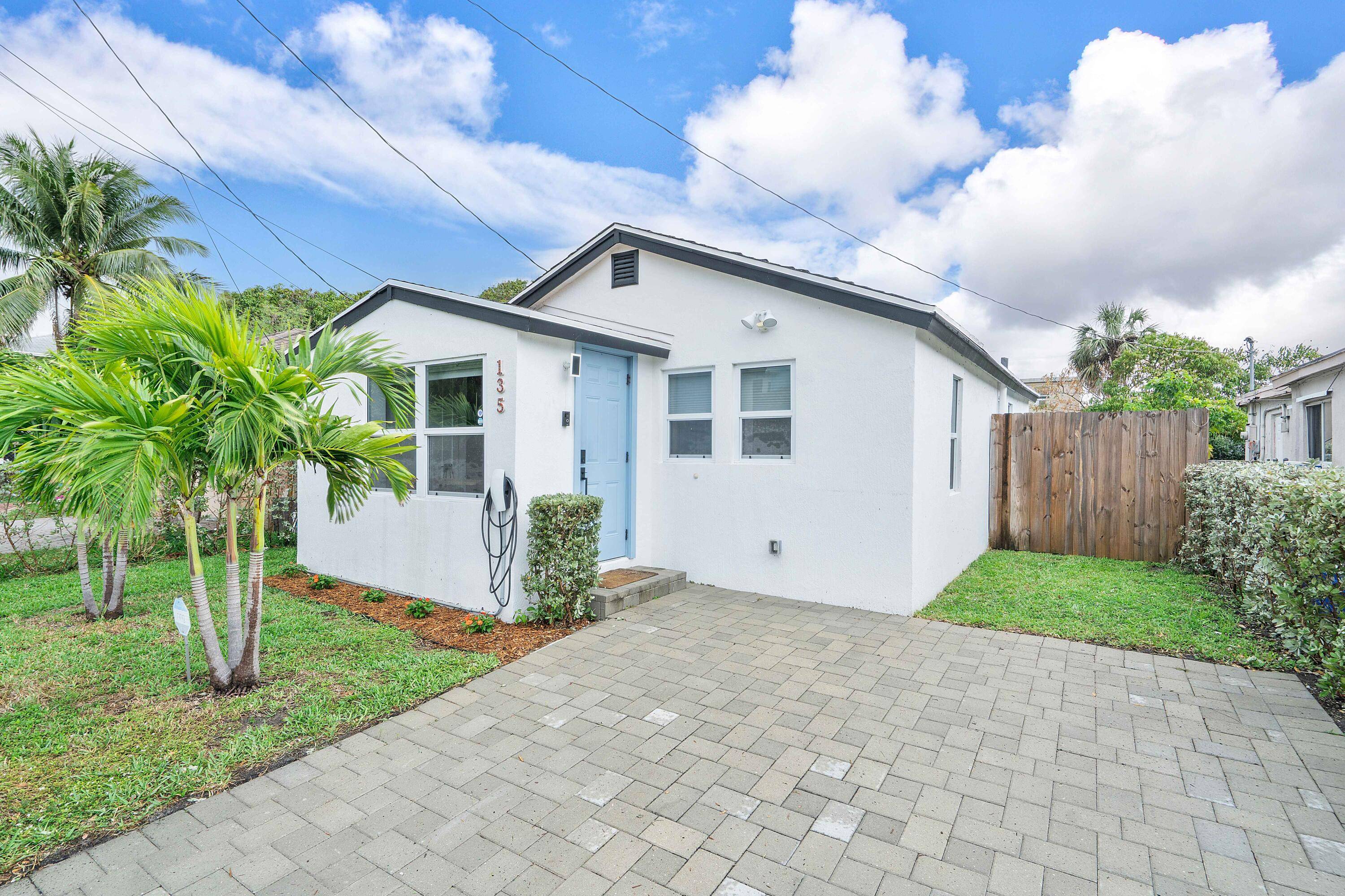 Experience coastal living at its finest in this beautifully renovated beach bungalow, just five minutes from the ocean.