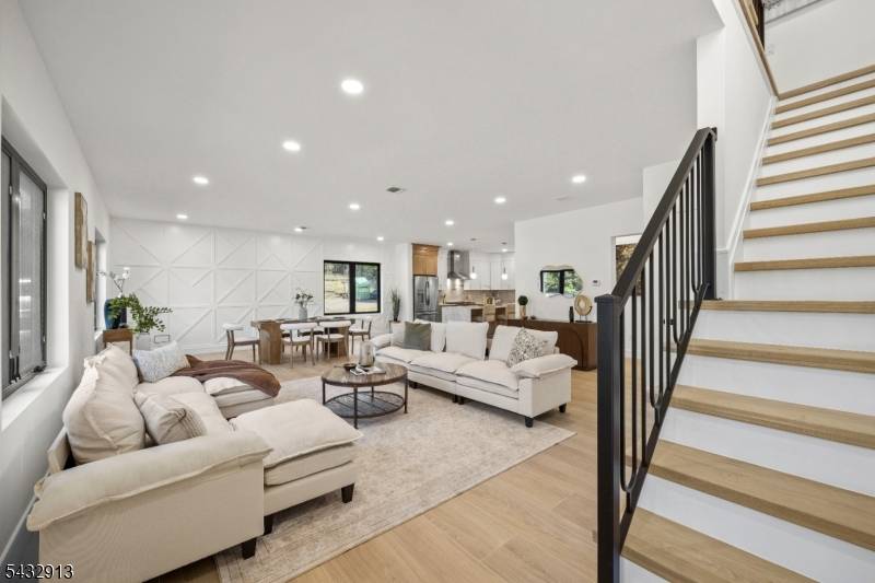 Stunning new construction modern home with an attached garage, thoughtfully designed with luxurious finishes and exceptional living space throughout.