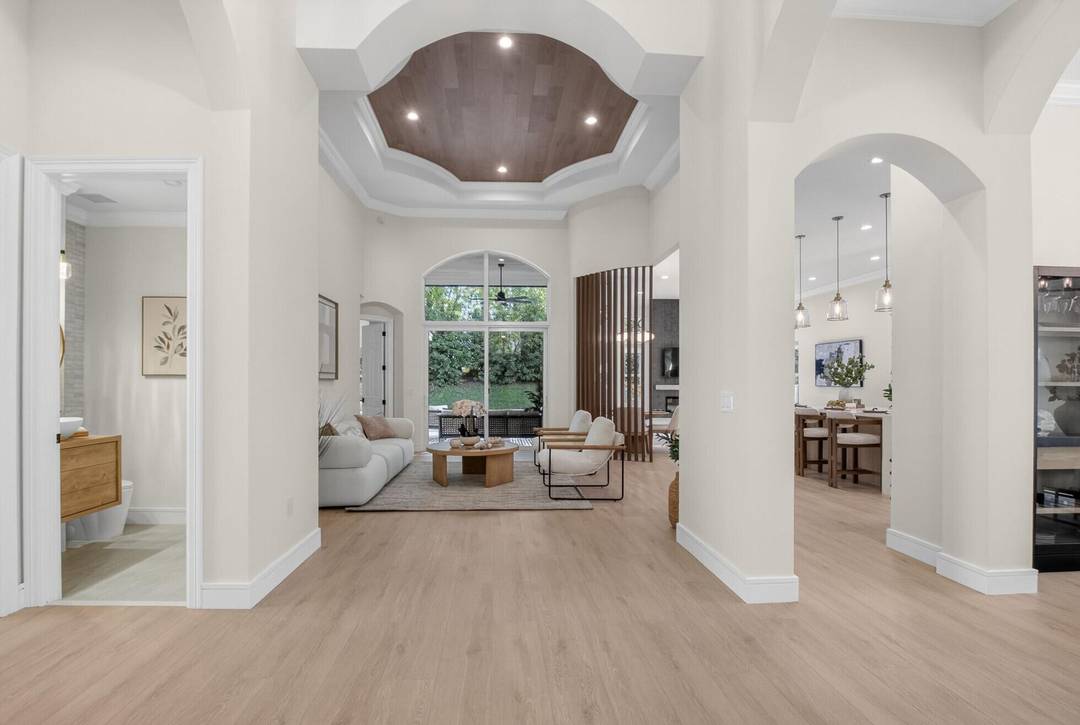 Welcome to 9722 Napoli Woods Lane, a stunning fully remodeled residence located in the highly desirable guard gated community of Saturnia Isles.