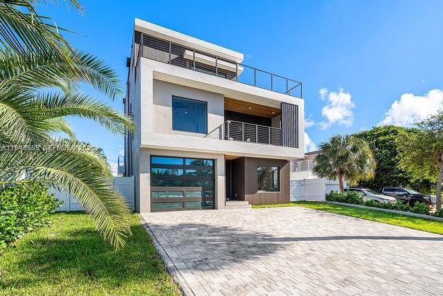 Experience the ultimate in coastal luxury living at this brand new 3 story modern masterpiece in Pompano Beach !