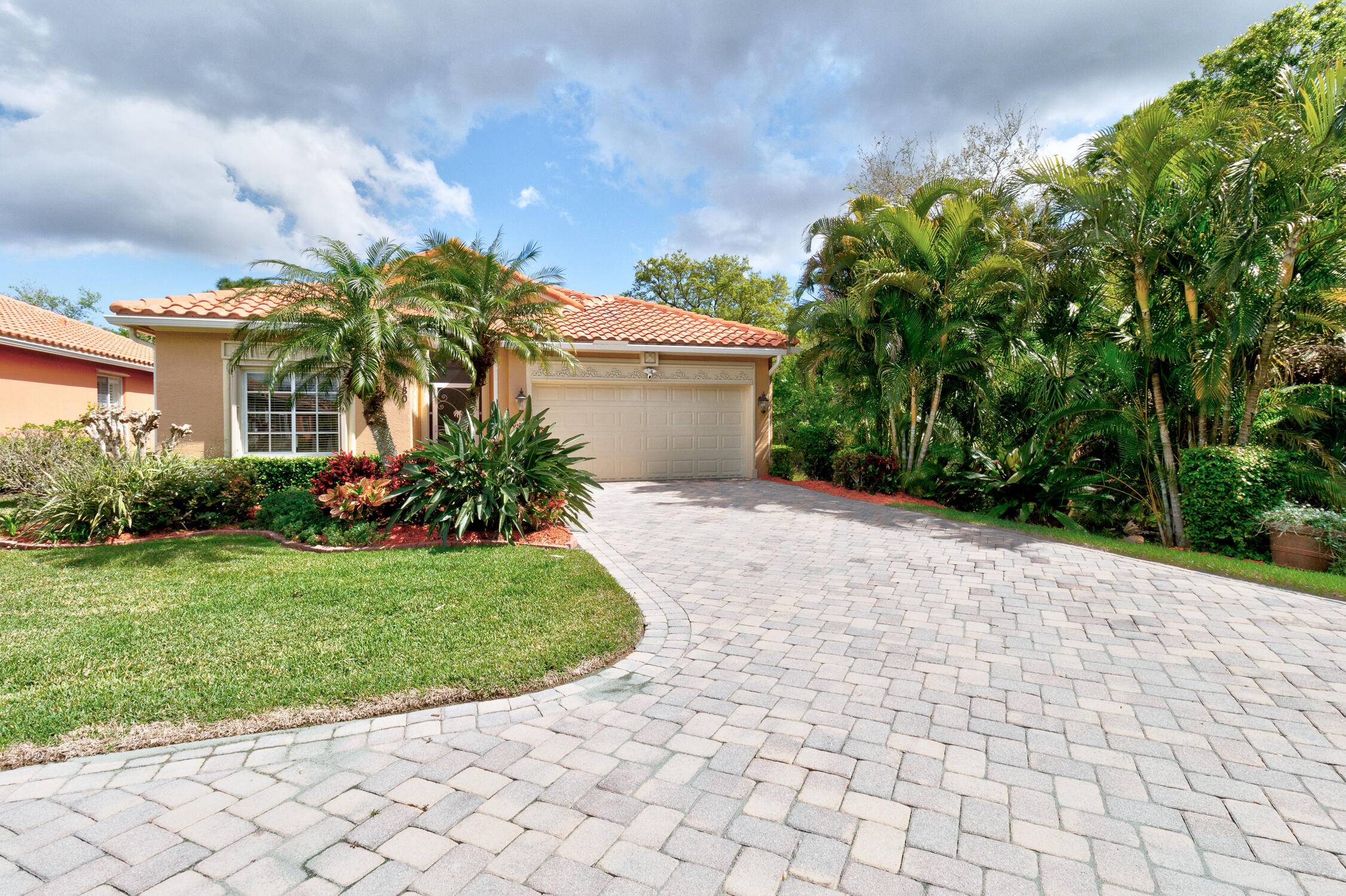 The long paver driveway leads you into this beautiful 3 2 2 home.