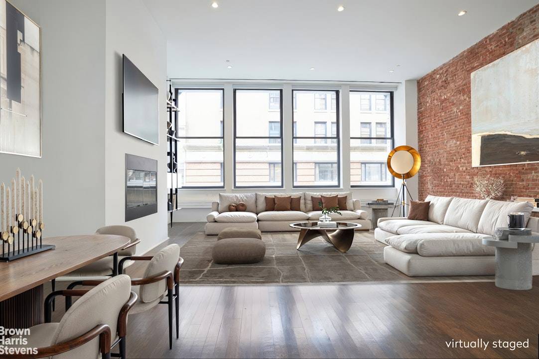 Enjoy soaring 13 ceilings in this 1, 742sqft 2 bedroom, 2 bath Condo loft on one of SoHo's premiere cobblestone streets.