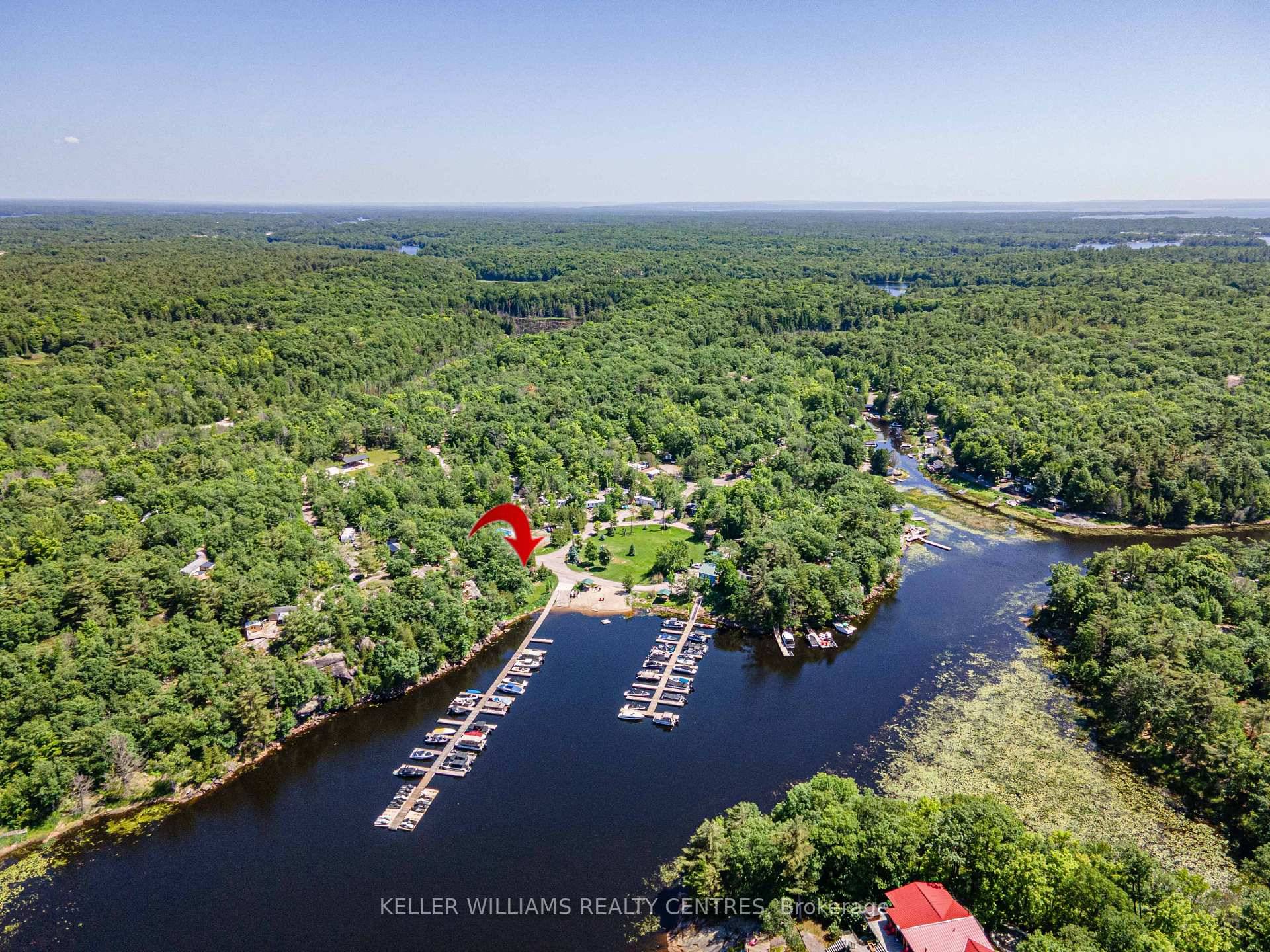 Enjoy breathtaking marina views from your lakeview windows and expansive covered deck overlooking North Honey Harbour Bay.