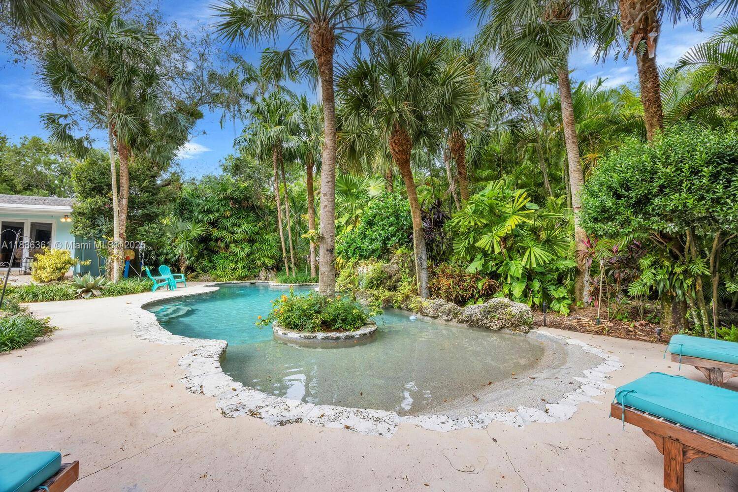 Motivated Sellers ! Remodel or Raze on this stunning Tropical Garden Acre.