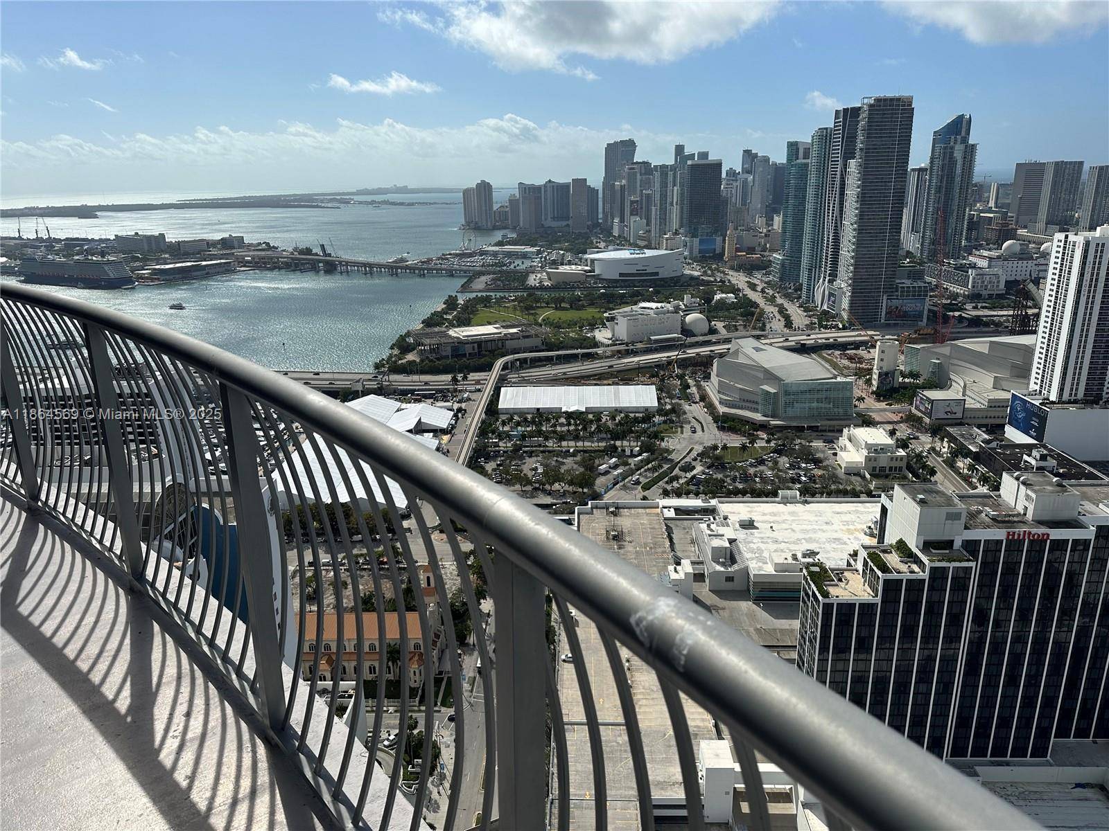 Penthouse on the 56th floor of Opera Tower with soaring 10ft ceilings, stunning bay and skyline views, and a spacious private balcony.