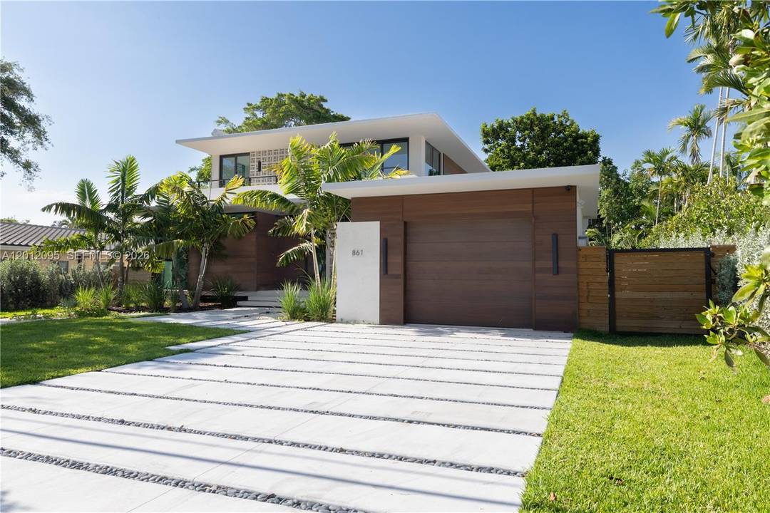 Experience the perfect blend of timeless design and modern luxury in this stunning tropical mid century residence.