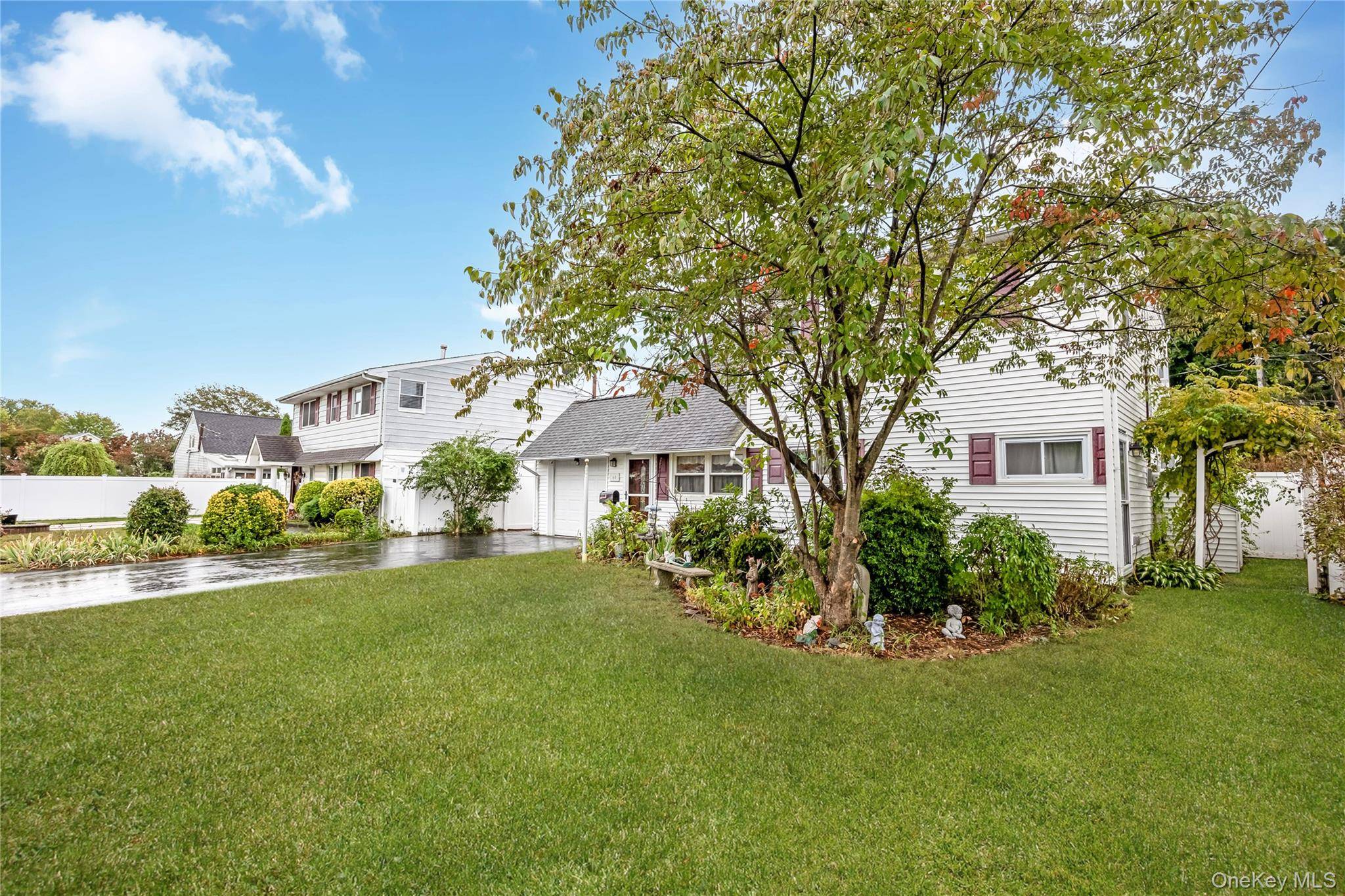 Beautiful Cape style Levitt home nestled on a quiet tree line street.