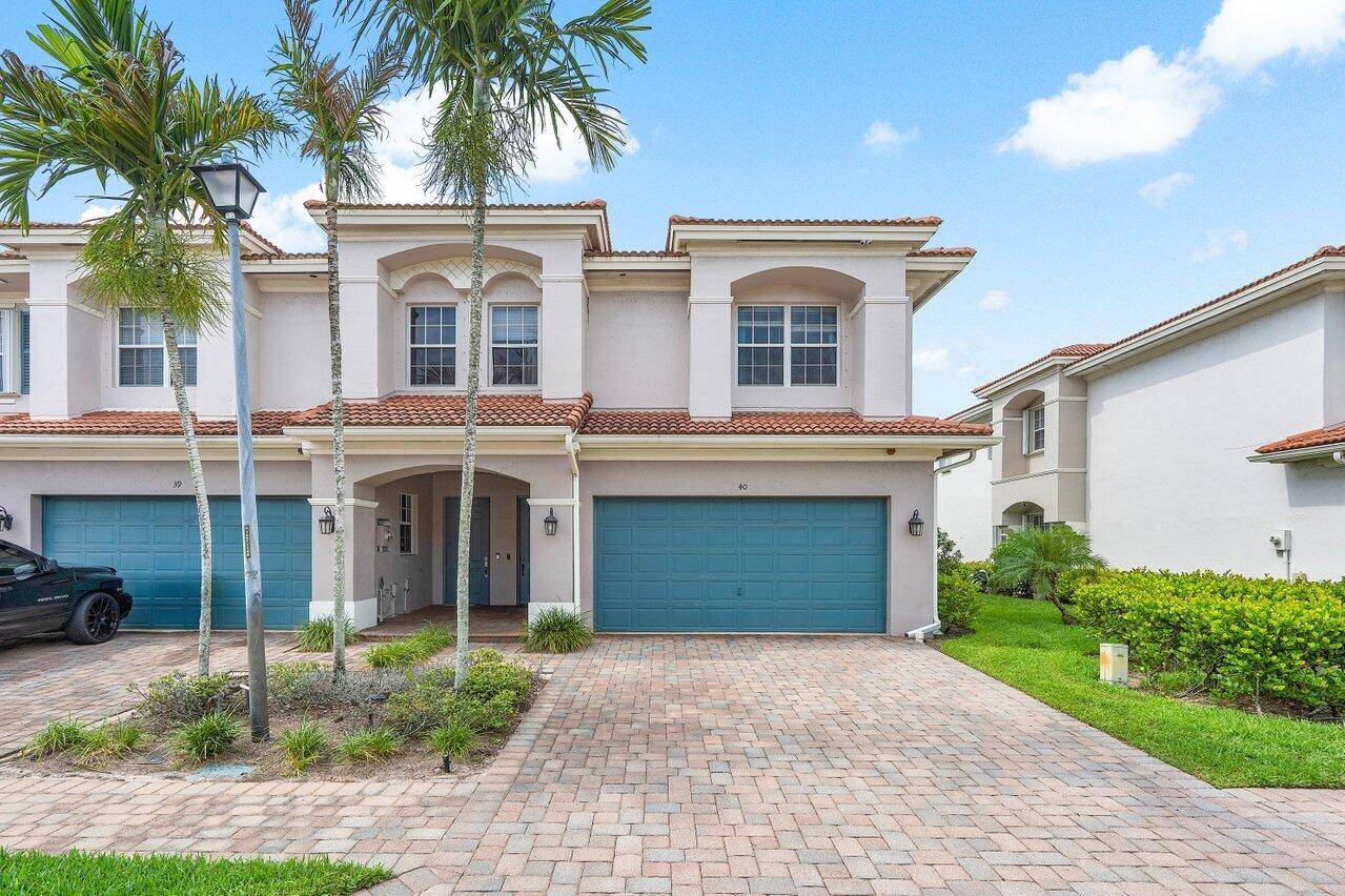 Welcome to this stunning corner unit townhouse, perfectly nestled in the desirable Carriage Pointe community.