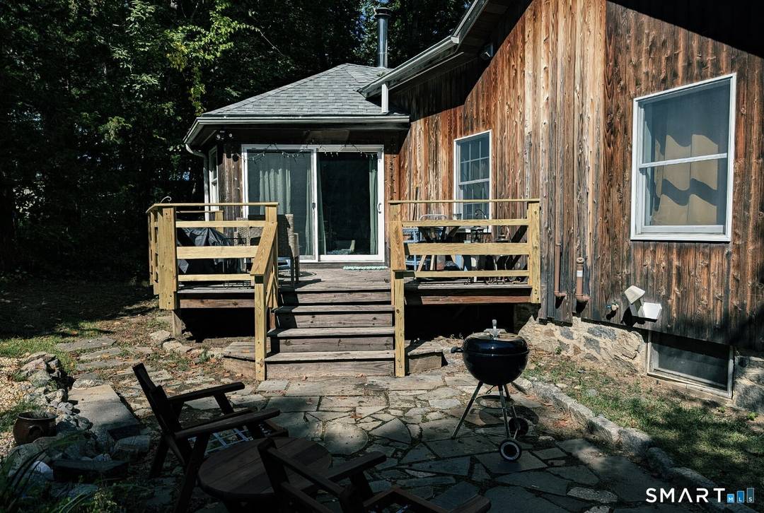 Tucked away on a lush, private wooded lot, this authentic retreat offers the ultimate shoreline lifestyle just in time for summer.