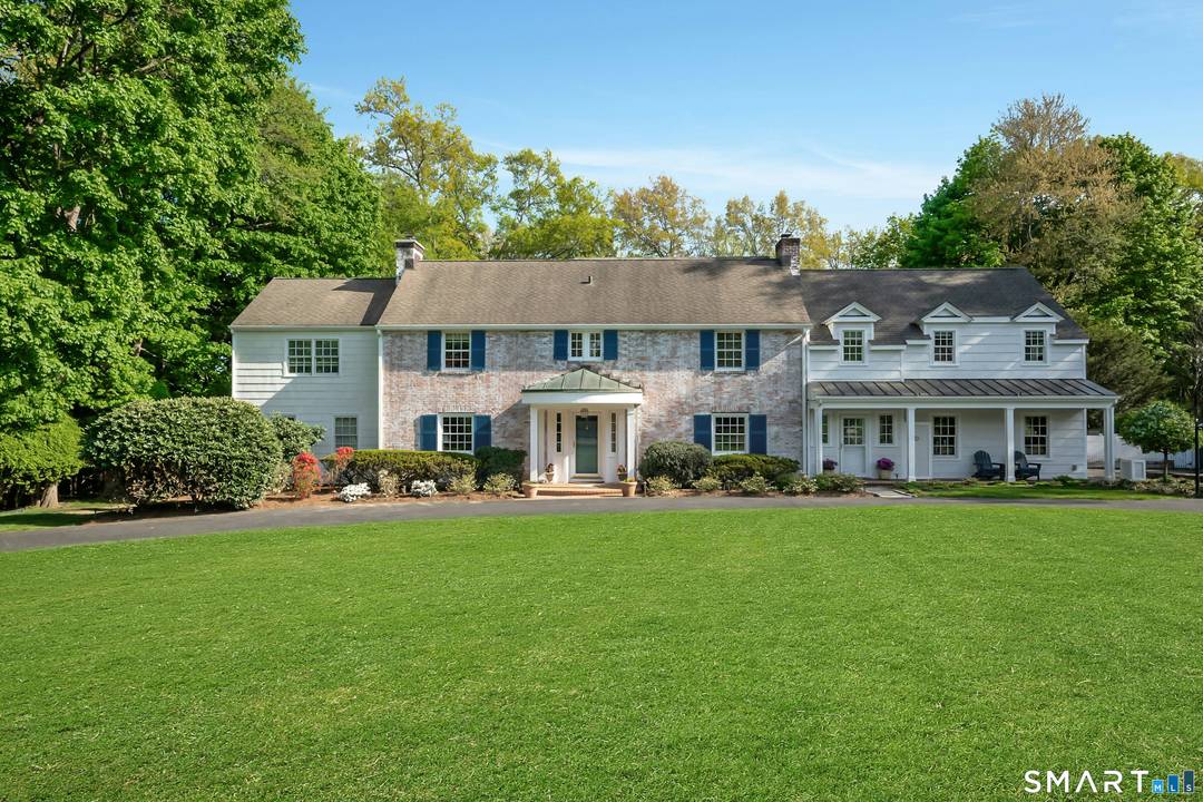 This charming and updated colonial home, steeped in gracious style and beautiful natural light, is a great place for entertaining.