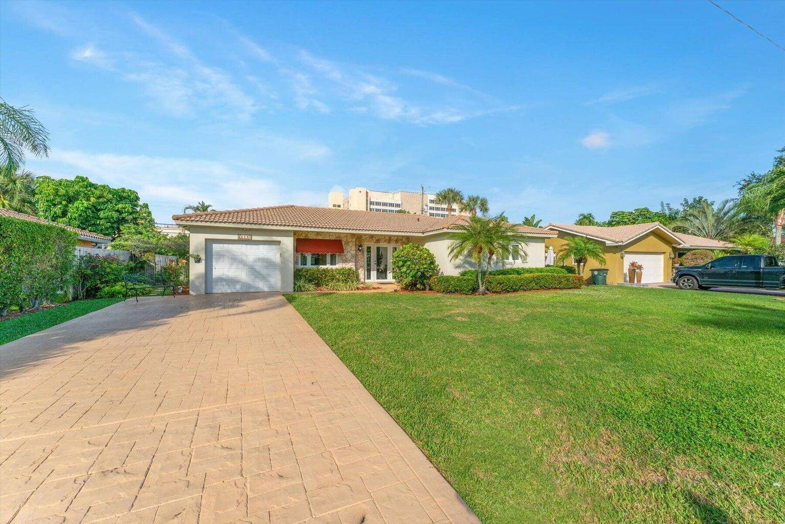 You are going to fall in love with this stunning 3 bedroom, 2 bathroom pool home in East Boca !