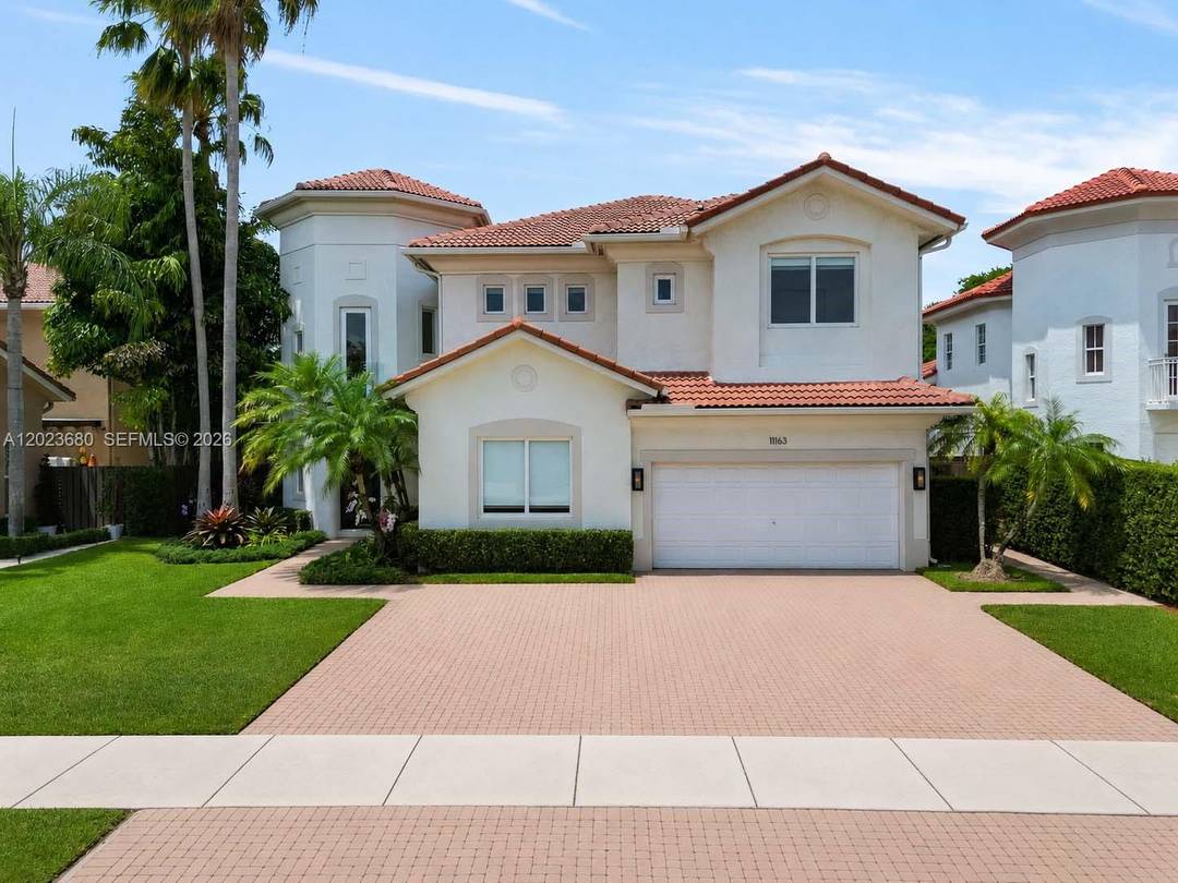 Experience luxury living prestigious Venetia neighborhood of Doral Isles.
