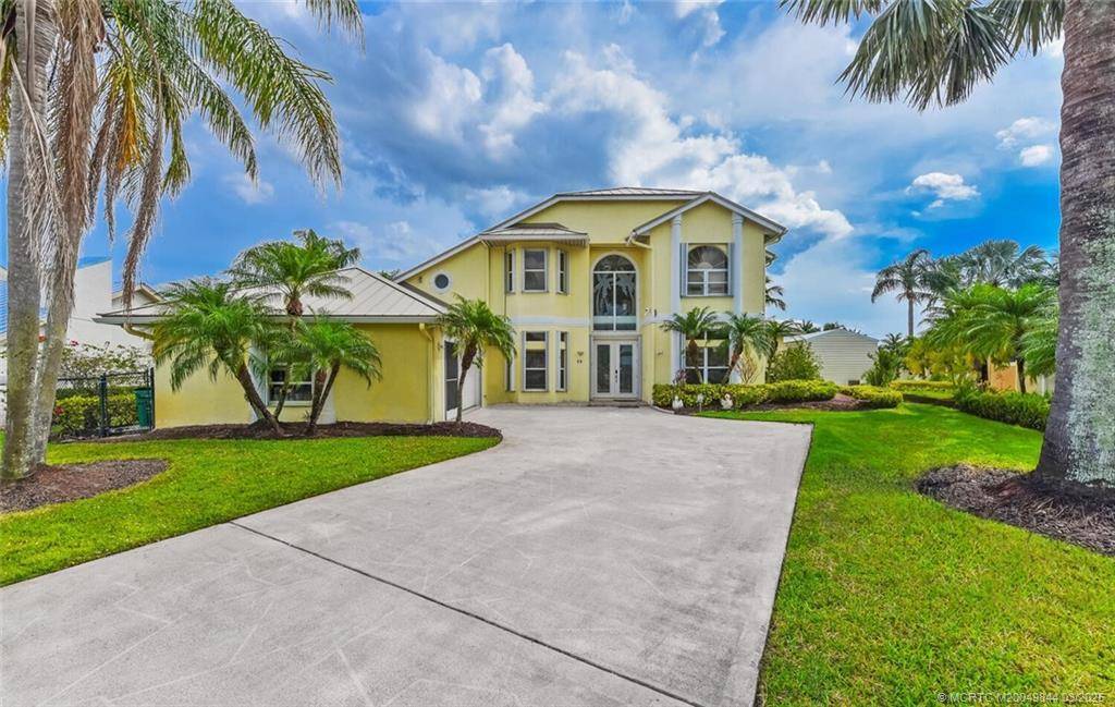 Enjoy tranquil water views and beautiful breezes from the back porch of this gorgeous home that sits on a cove in the St.