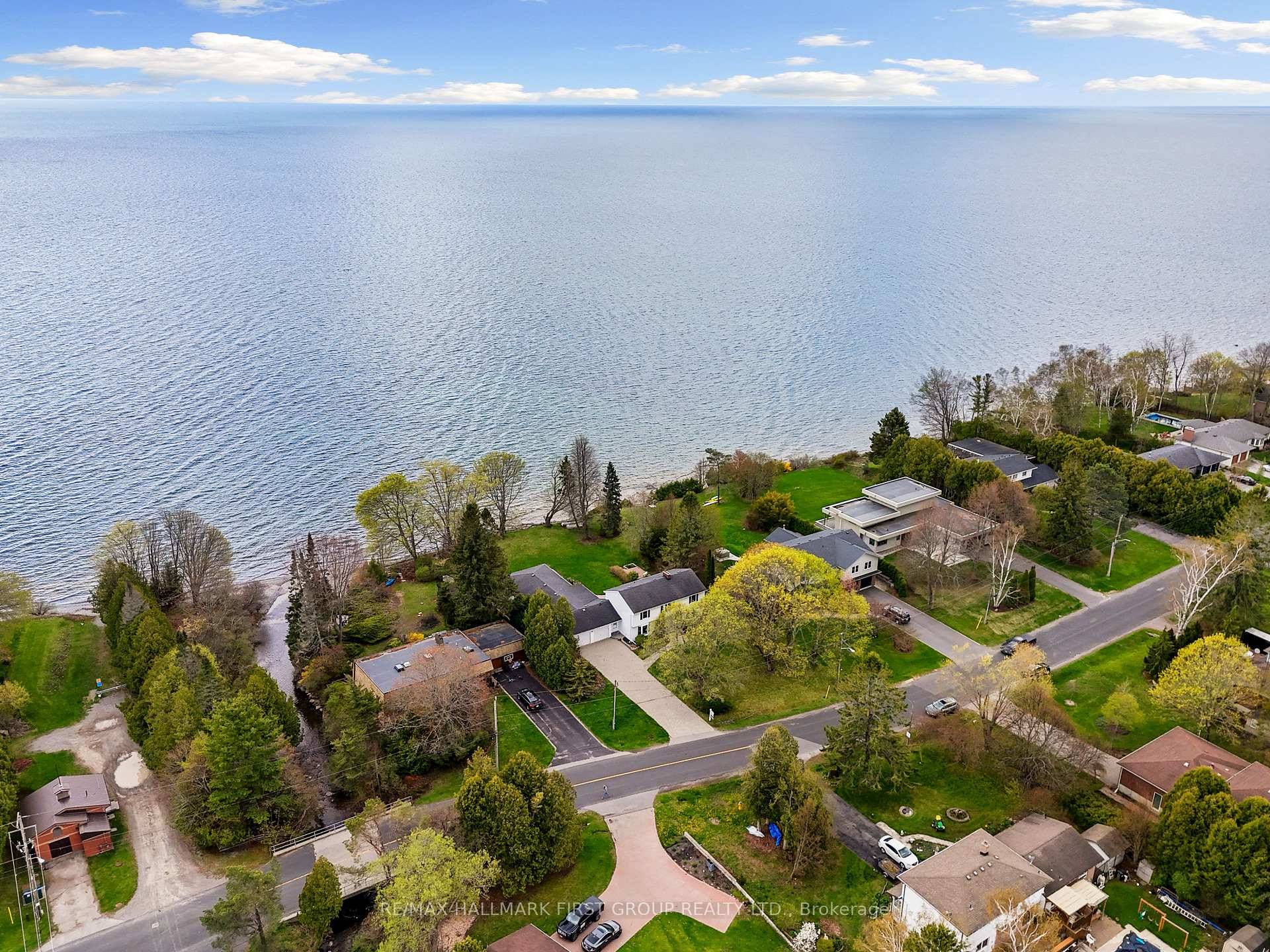 Imagine waking up to the serene sounds of rolling waves in this breathtaking Lake Ontario home in Cobourg, where dreams of lakeside living come to life.