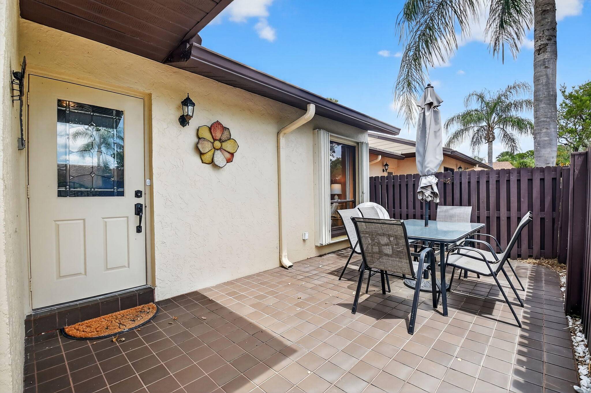 Enter through an expansive, private front patio into your villa and be immediately greeted by a pretty water view.