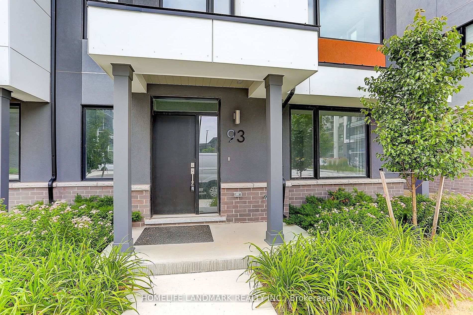 End unit stunning contemporary style townhome with 2 car garage.
