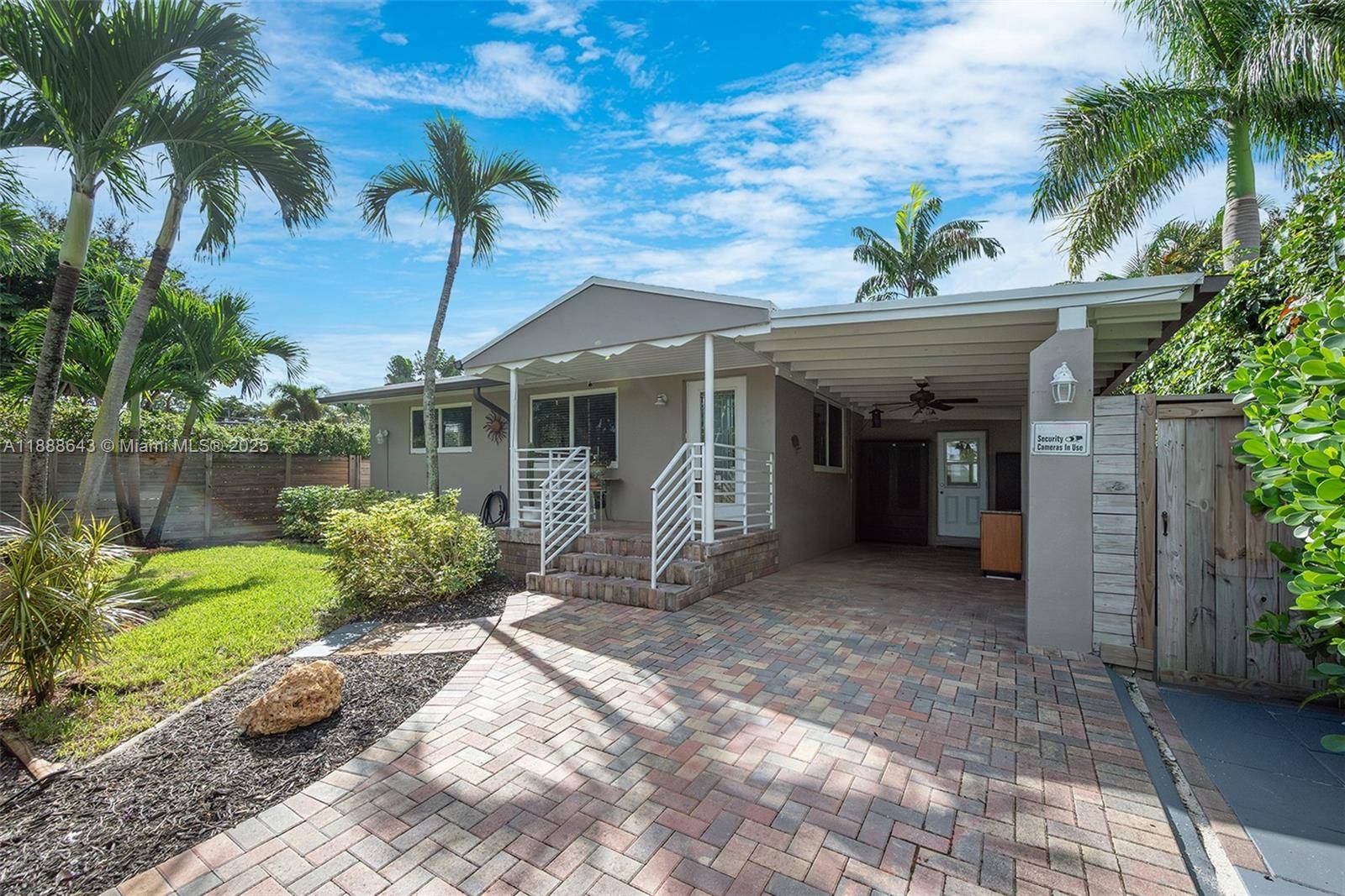 Discover this 2 bedroom, 1 bath home featuring impact windows and pristine landscaping, with plenty of space to add a pool or design your own tropical outdoor oasis.