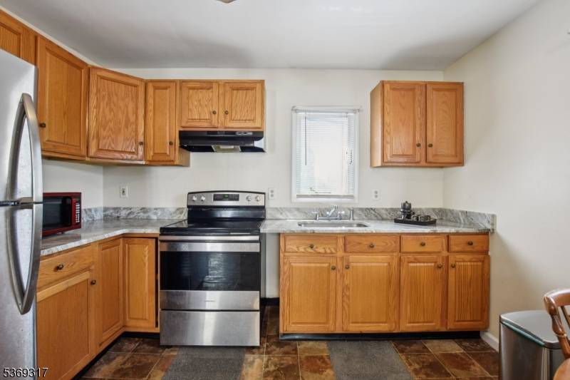 Charming and spacious Colonial style home just steps from the lake and playground.