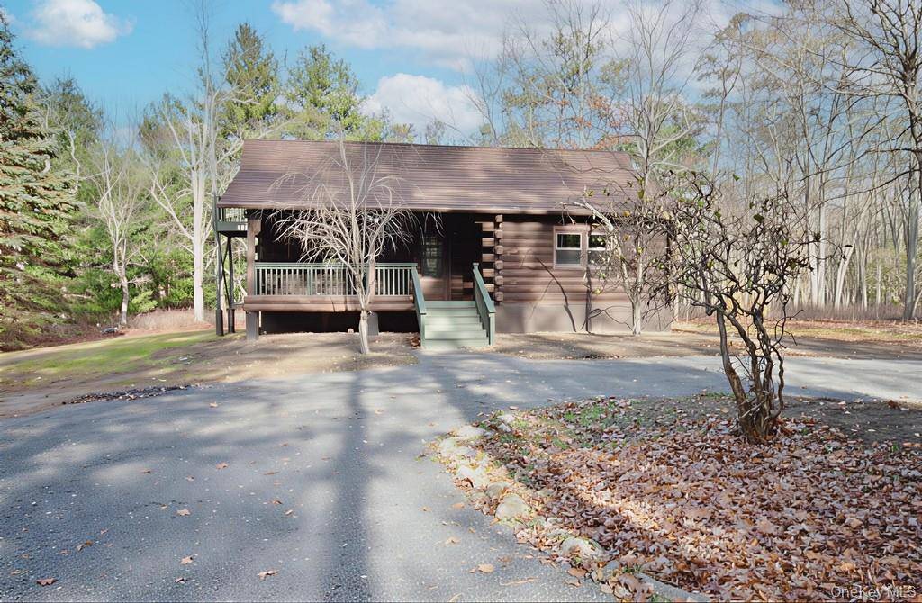 Nestled in the serene gated Black Forest Community in Glen Spey, this enchanting log home is a blend of rustic charm and modern amenities.