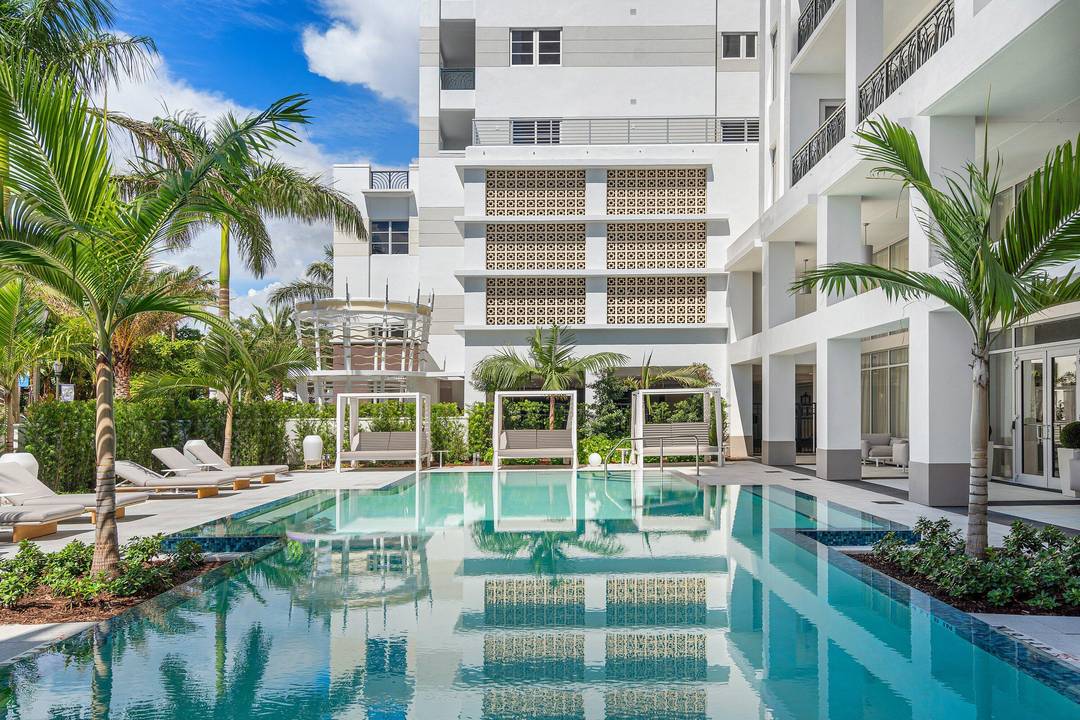 High floor residence with sweeping views over Mizner Park and a glimpse of the ocean, offering one of the most desirable exposures in Tower 155.