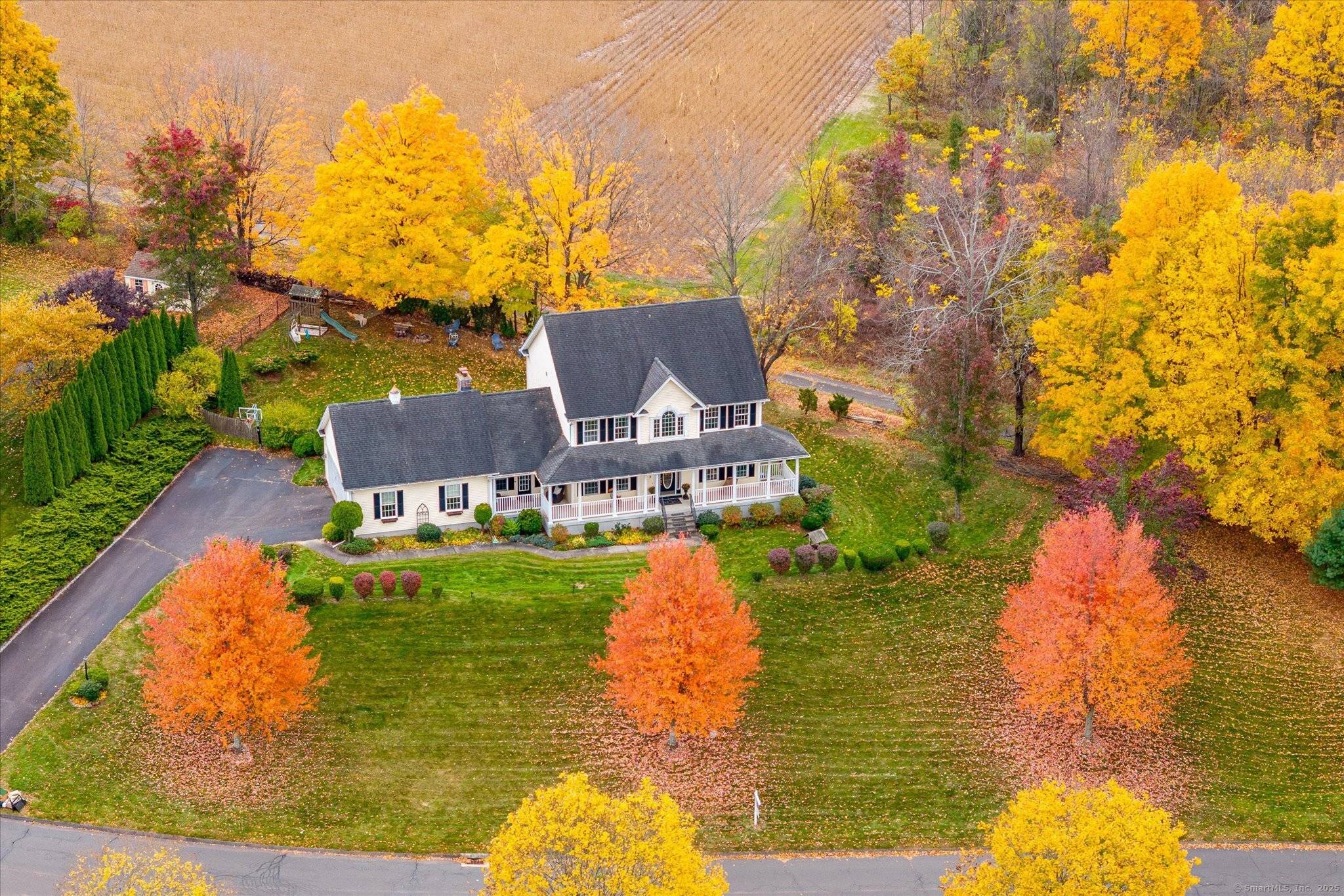 Set against a backdrop of brilliant fall colors, this stunning 4 bedroom, 2.