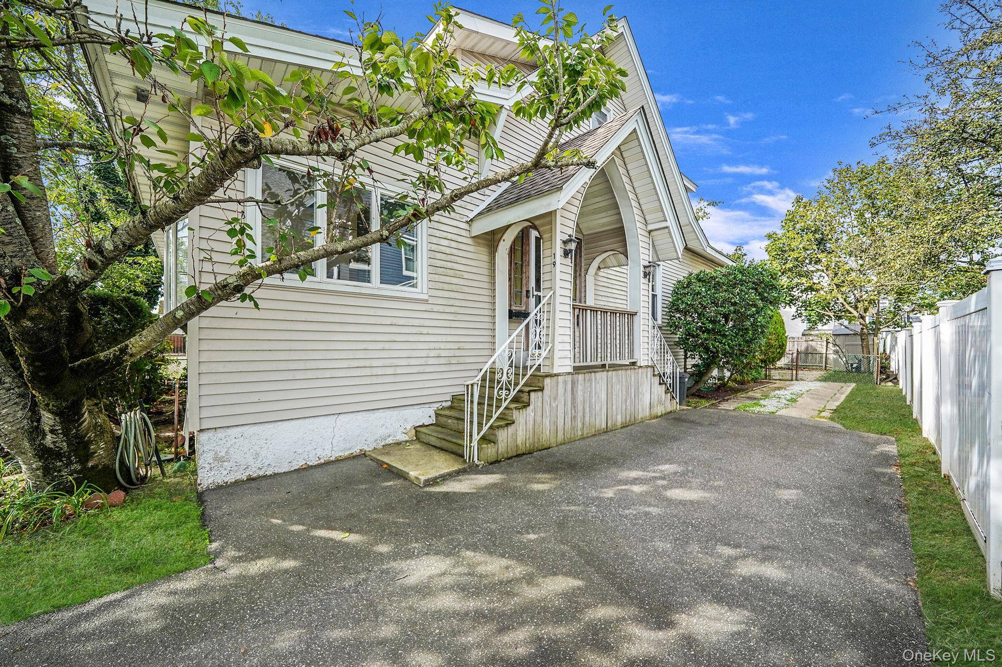 Charming two family home located in the heart of the Village of East Rockaway.