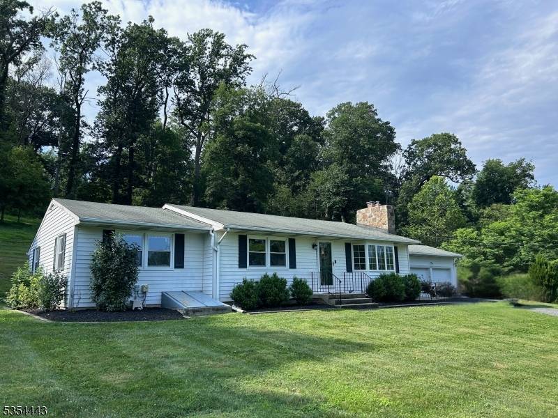Discover peace and serenity in this charming, south facing, ranch style home.