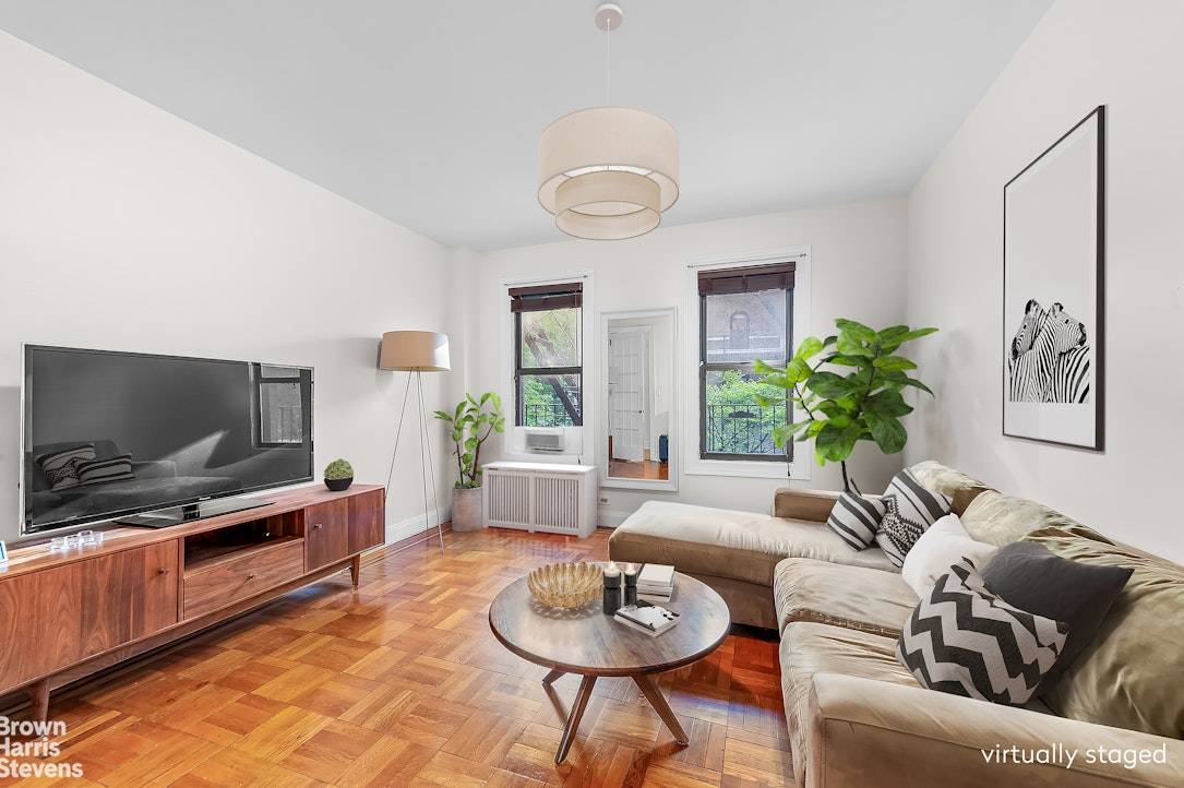 Welcome to this spacious three bedroom apartment located on a charming tree lined street in a stunning prewar building.