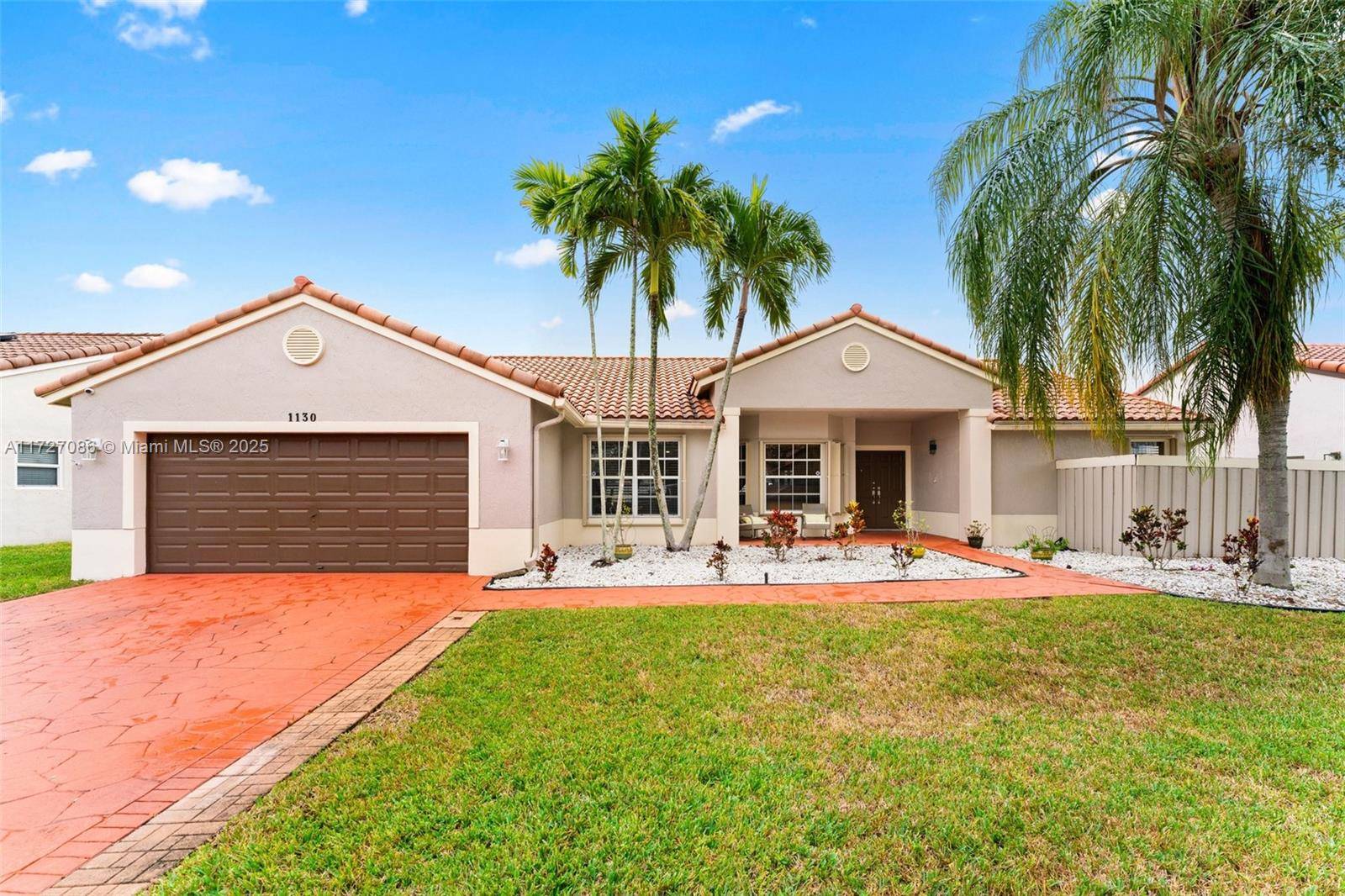 Just 7 minutes from Sawgrass Mills, one of Florida's premier shopping destinations, this stunning one story home features a covered pool and a spacious backyard, offering the perfect retreat for ...