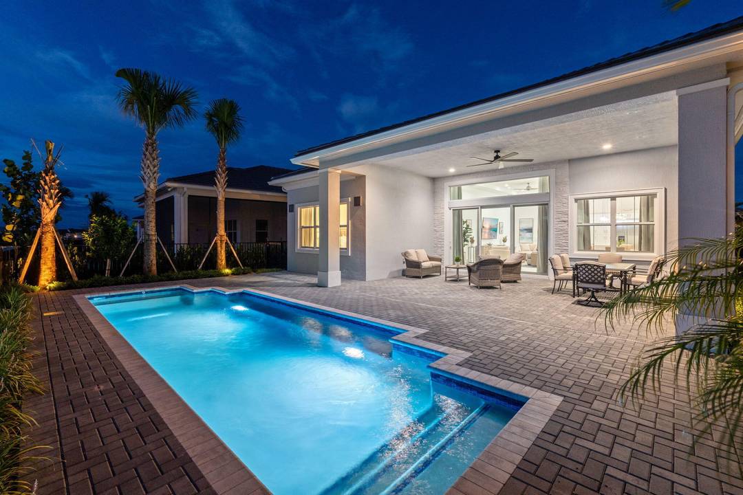 Exceptional, fully finished new construction on one of the best water lots in one of Palm Beach Gardens' most sought after 55 communities, offering true country club style living with ...