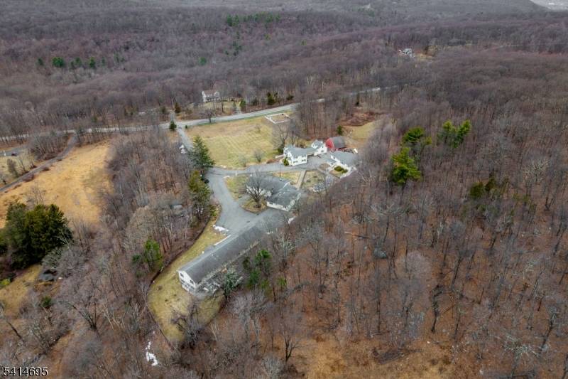 Discover an unparalleled real estate opportunity at 240 Longhouse Dr, West Milford, a sprawling 51.