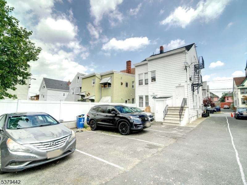 Welcome to a truly rare find a beautifully renovated legal 3 family home featuring a bonus finished walkout basement and private parking for multiple vehicles.