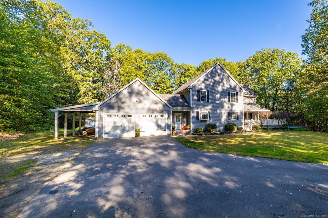 You'll fall in love with this stunning custom built Colonial nestled on over 4 private acres !