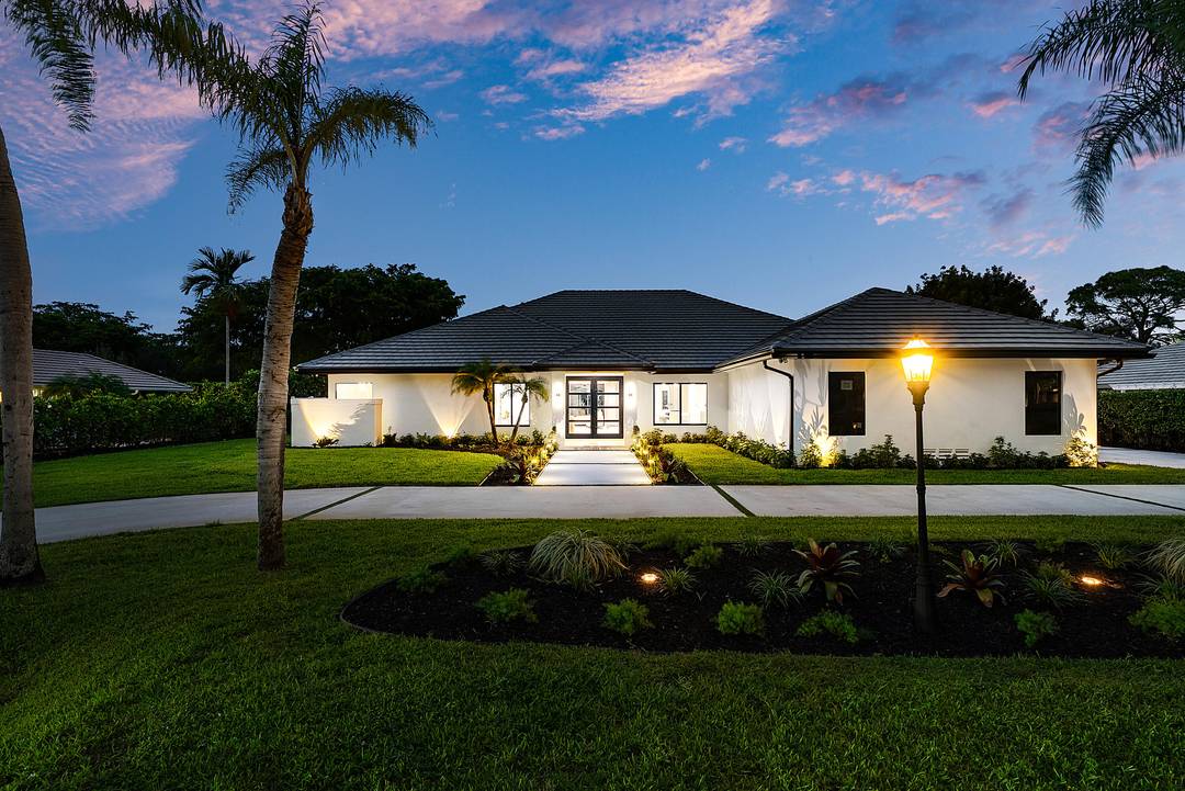 Welcome to this true designer Smart Home located in the prestigious, non mandatory membership Pine Tree community of Boynton Beach.