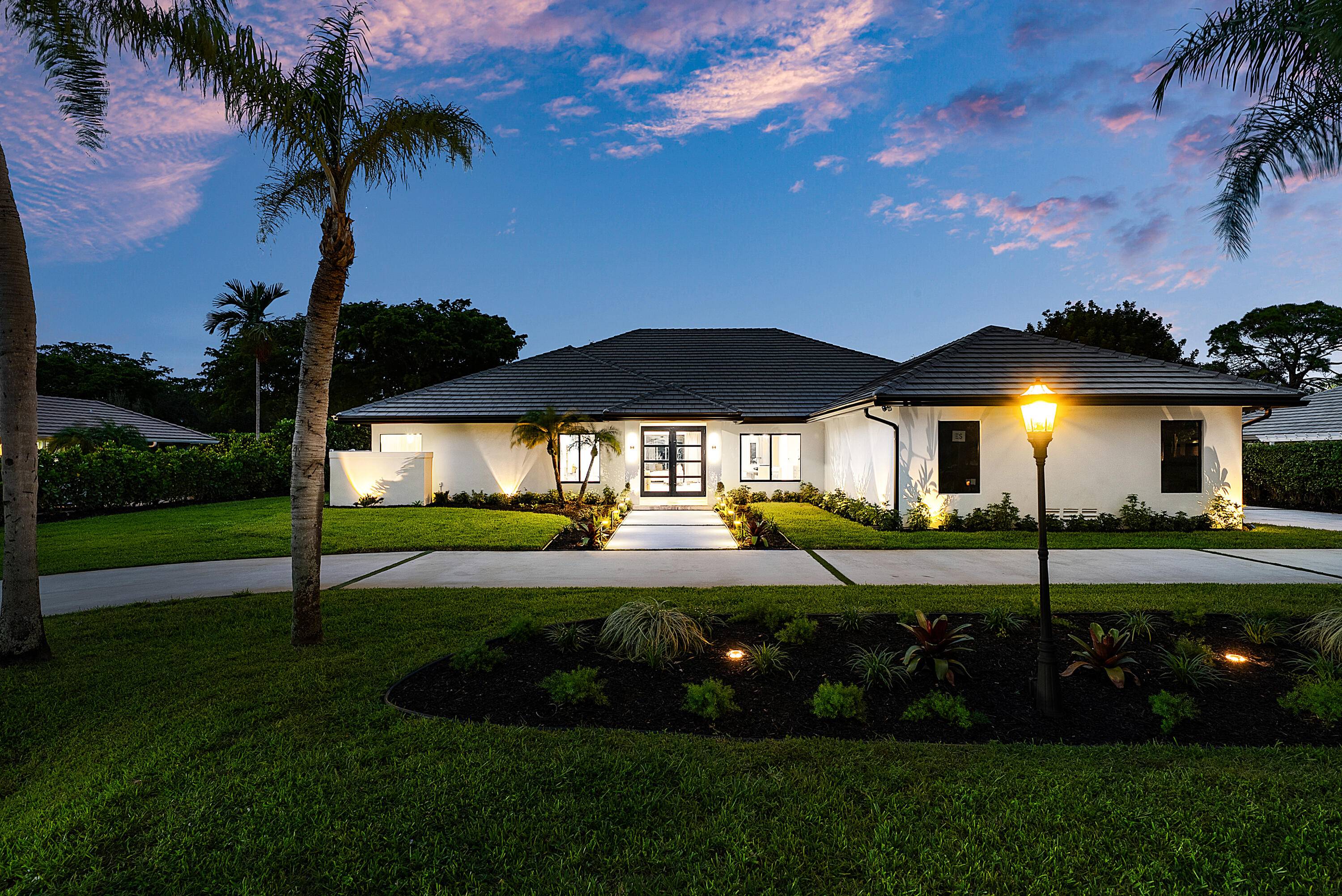 Experience refined luxury in this true designer Smart Home located in the prestigious, non mandatory Pine Tree Golf Club of Boynton Beach.