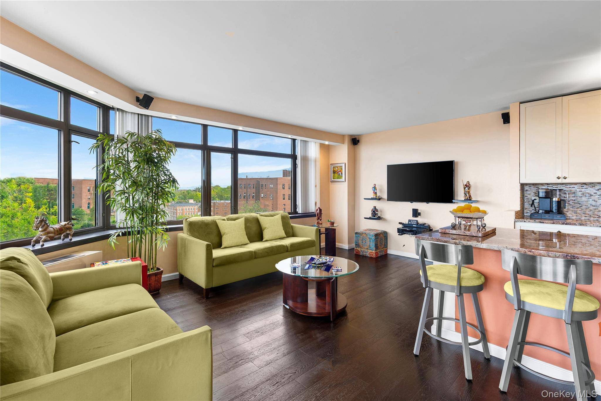 Step into timeless sophistication at The Pinnacle Condominium, where this elegantly renovated corner two bedroom, two bath residence redefines luxury living in the heart of Forest Hills.