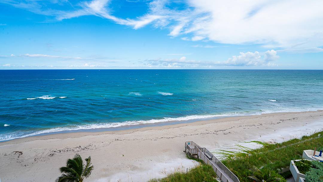 DIRECT OCEANFRONT CONDO with unobstructed panoramic views surrounded by gorgeous blue turquoise water overlooking the ocean to the east and southern views including the intracoastal.