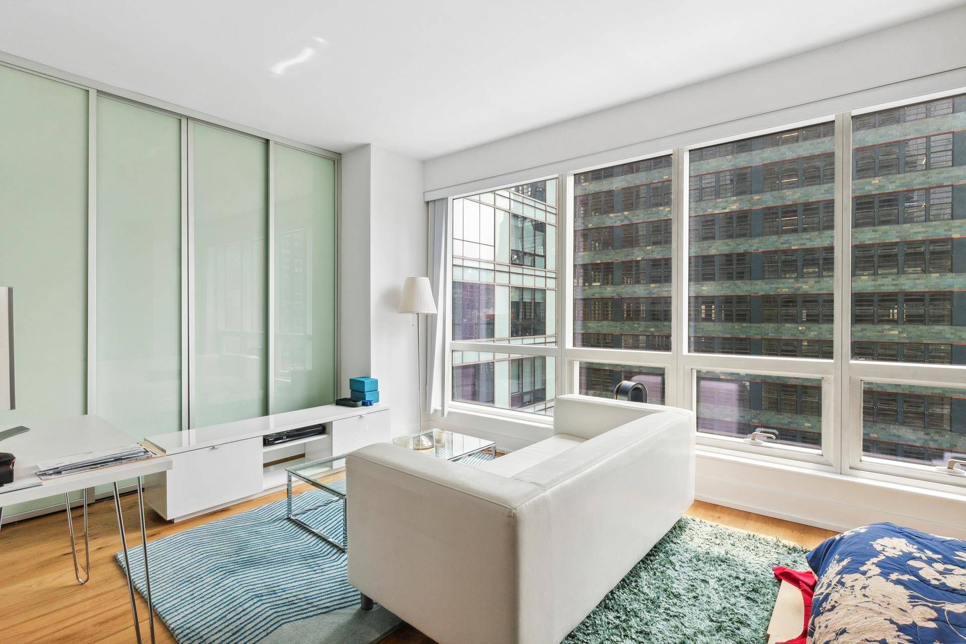Welcome to the vibrant heart of New York City at 350 West 42nd Street, Unit 16J !