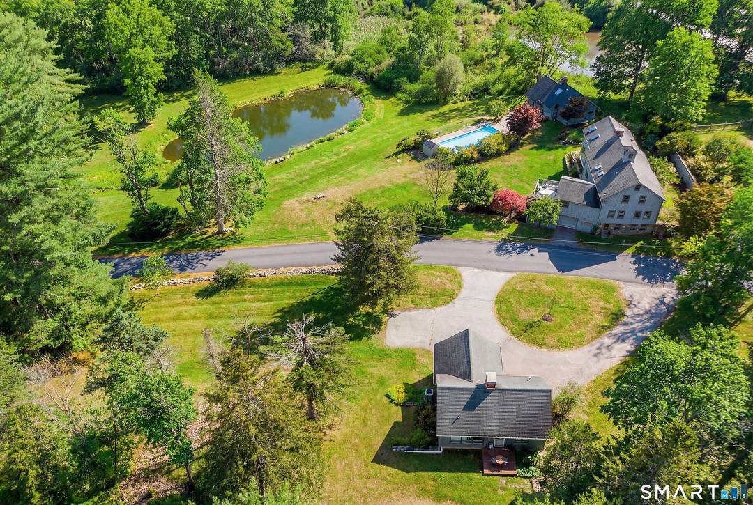 Exceptional private country estate set on approximately 10 acres in Sherman, just 90 minutes from New York City and moments from Candlewood Lake with beach and boat rights.