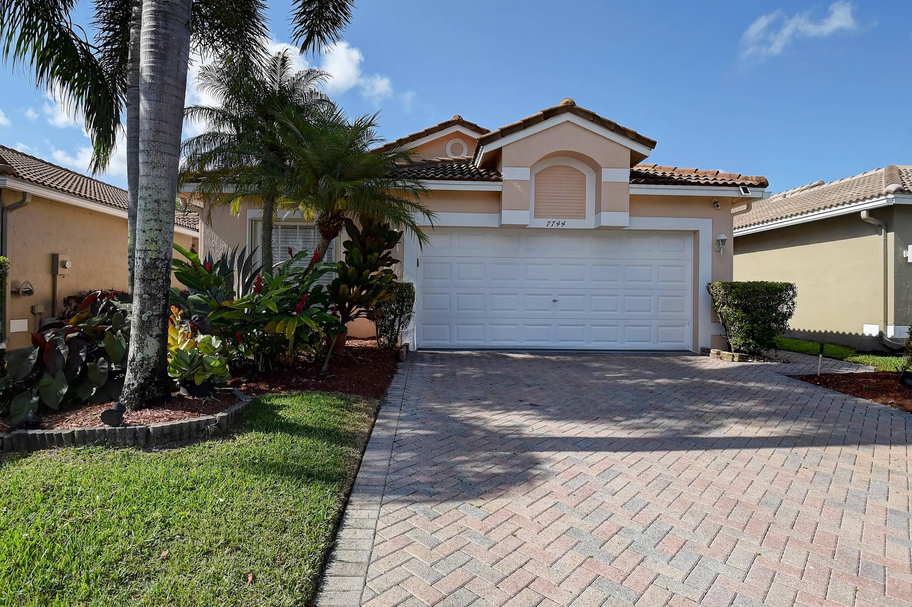 NEW ROOF SEPT 2022 ! Lake front Cypress Model is a SF 2 BR Den 2BA 2CG is equipped w Accordion Hurricane Shutters.