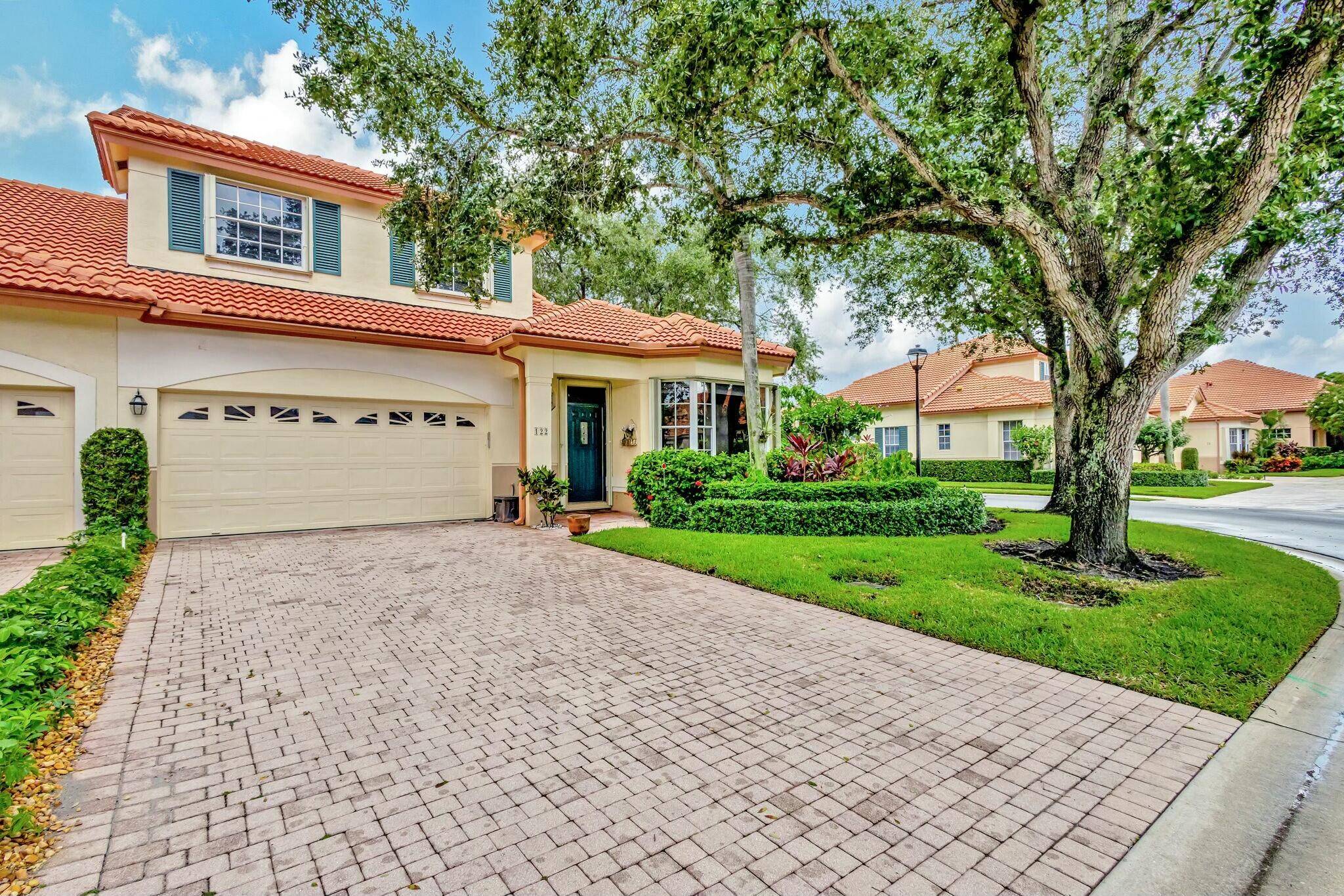 Immaculate Large End Unit Townhome in Highly Sought After Community of Monterey Pointe in PGA National.